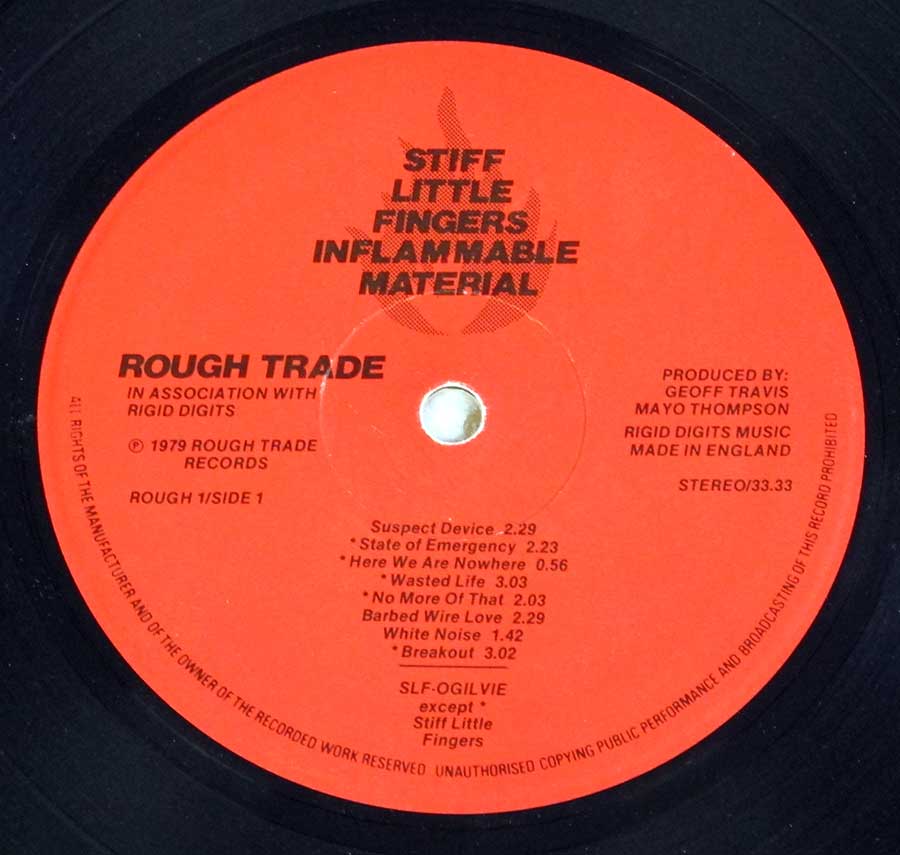 "Inflammable Material" Orange/Red Colour ROUGH Record Label Details: Rough Trade in Association with Rigid Digits ROUGH 1 ℗ 1979 Rough Trade Sound Copyright 